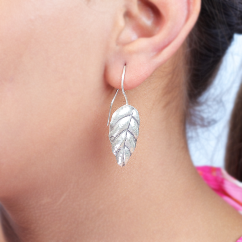 Oxidized silver leaf earrings styled on model – elegant traditional jewelry for weddings and cultural events