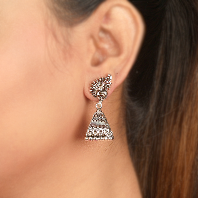 Oxidized silver peacock jhumka earrings on model – stylish festive accessory for weddings, Karwa Chauth, and Durga Puja outfits