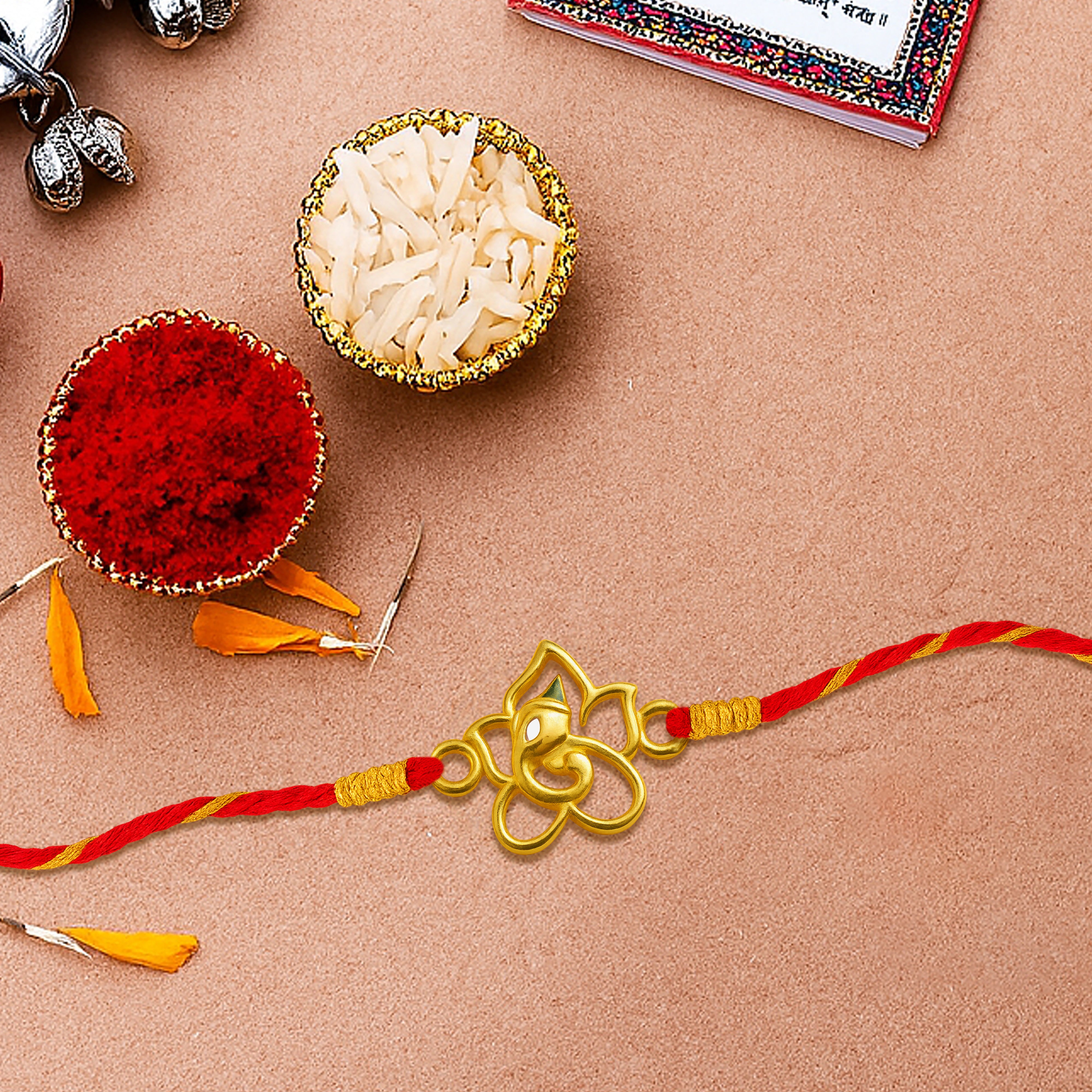 Silver rakhi for brother with Lord Ganesha in floral design – original silver rakhi and silver rakhi design with price for Raksha Bandhan