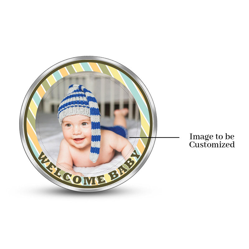 Round 999 silver coin with customised Welcome Baby newborn design.