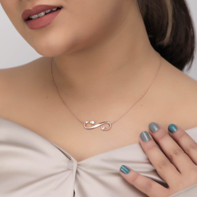 Model wearing Rose Gold Infinity Pendant Necklace – Navratri jewelry accessory for festive outfits