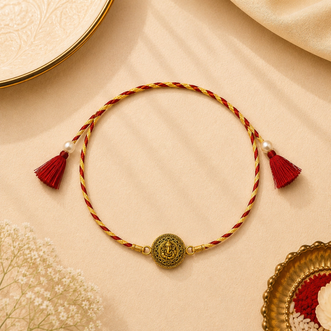 Silver Embossed Lord Ganesha Rakhi placed with roli chawal and festive decor – premium 925 silver Raksha Bandhan gift by Silviya.