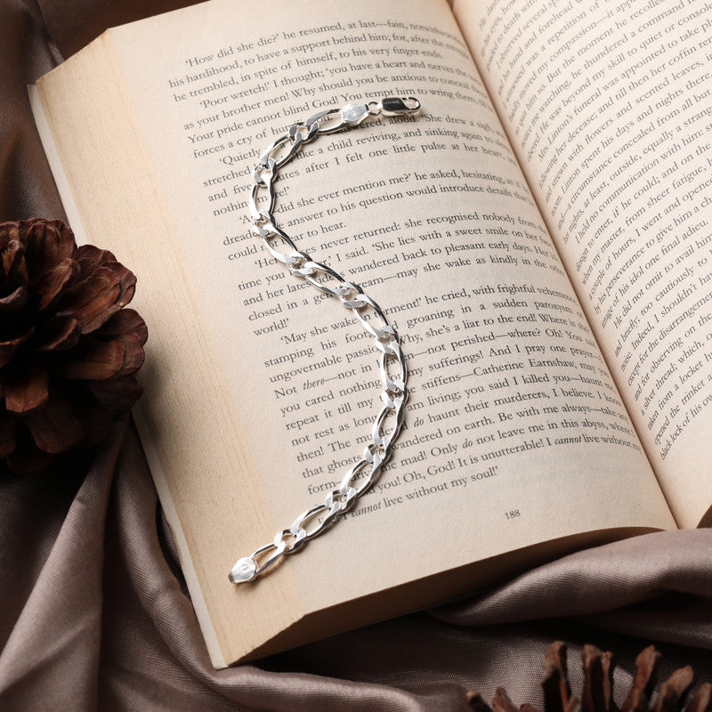 Close-up of Silver Figaro Bracelet on white background
