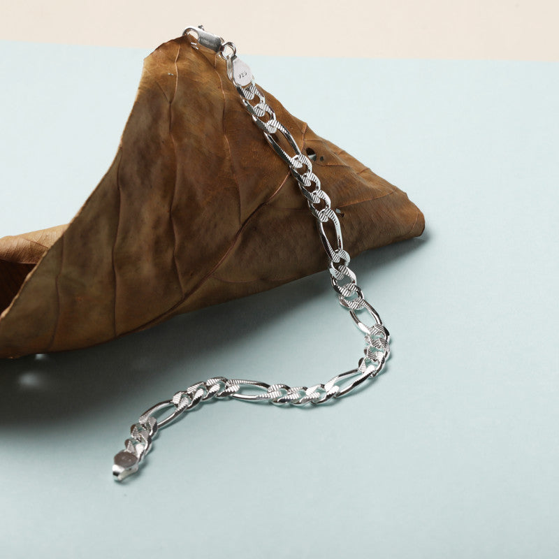 Close-up of Silver Figaro Diamond Cut Bracelet on white background