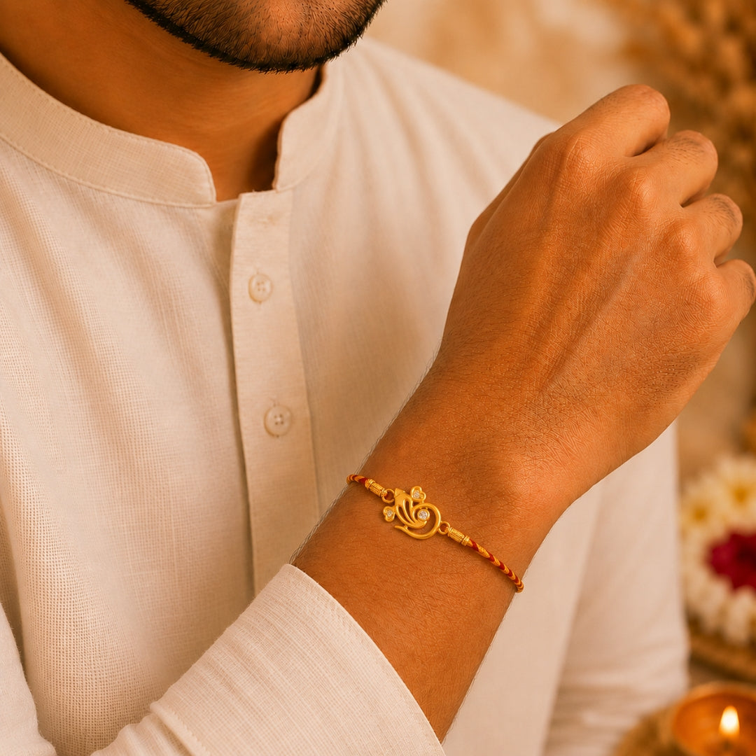 Brother wearing Silver Lord Ganesha Rakhi by Silviya – 925 silver rakhi for Raksha Bandhan.