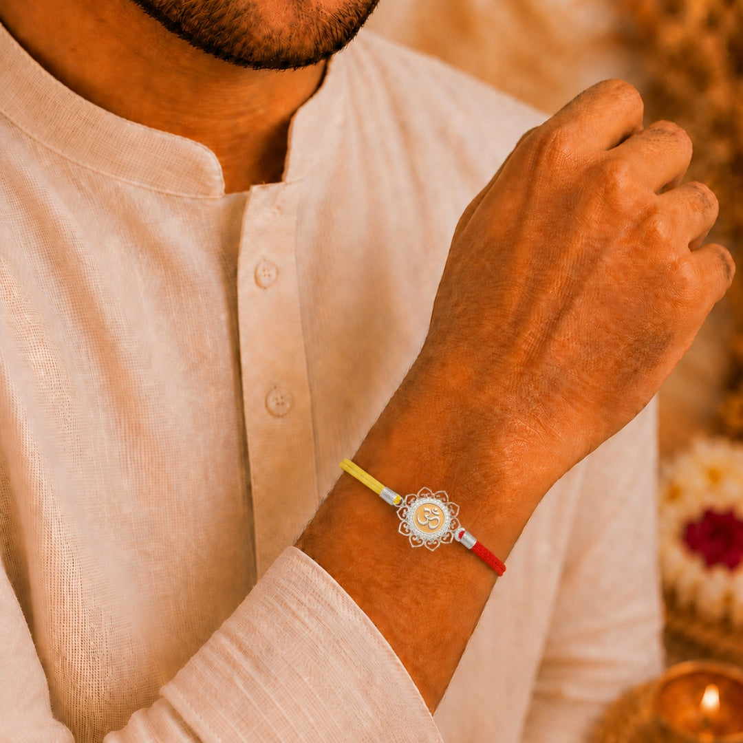 Brother wearing Silver Om Flower Rakhi by Silviya – 925 silver rakhi for Raksha Bandhan.