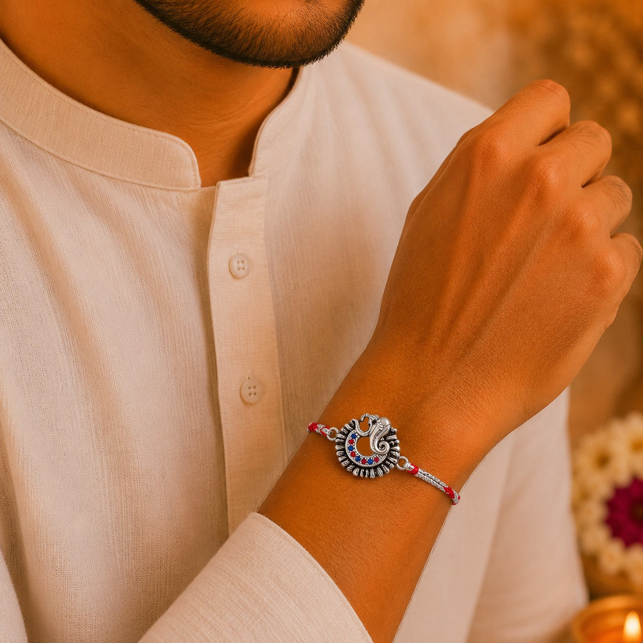 Brother wearing Silver Om & Ganesha Rakhi made with 925 Sterling Silver
