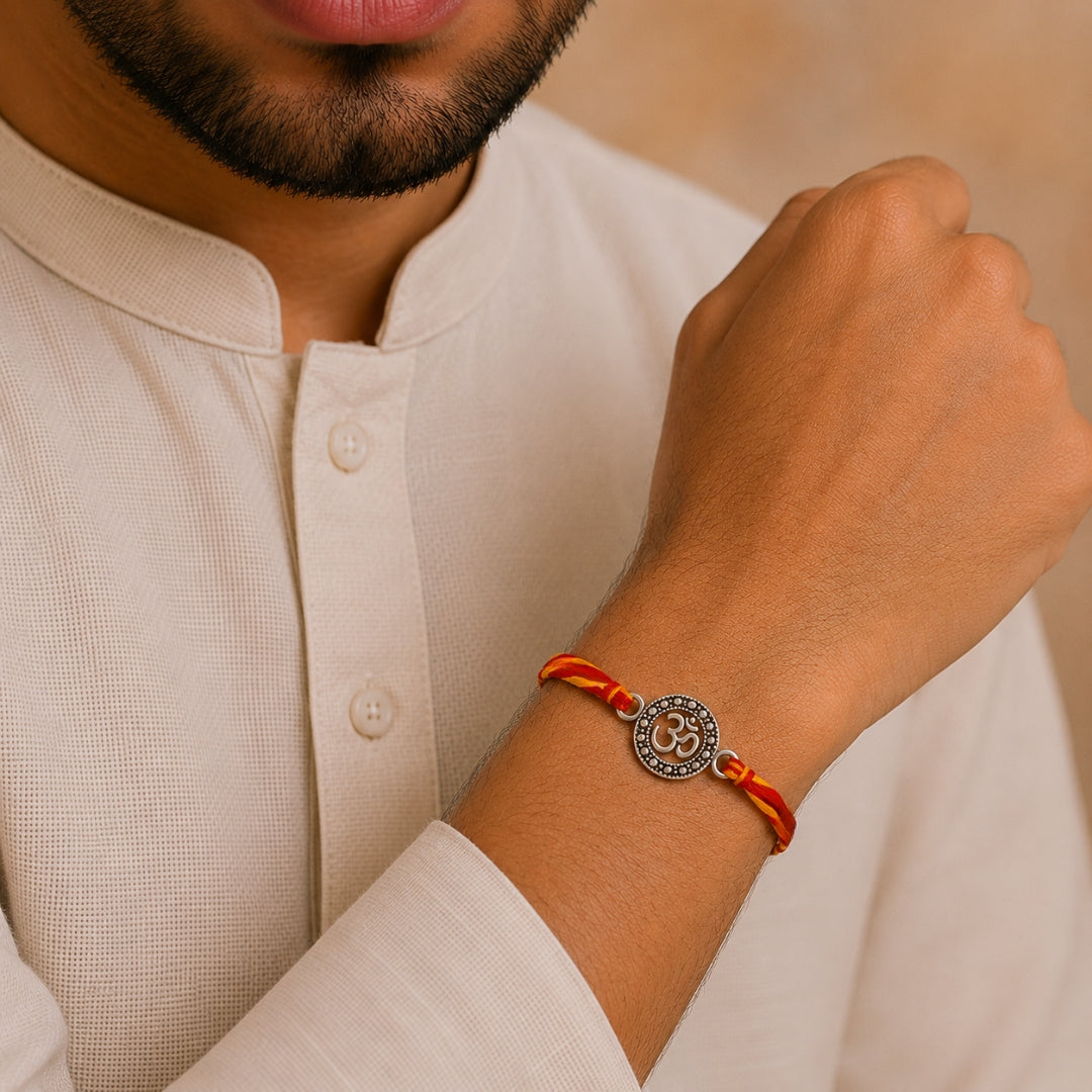 Brother wearing Silver Om Style Rakhi by Silviya – spiritual 925 silver rakhi for Raksha Bandhan.