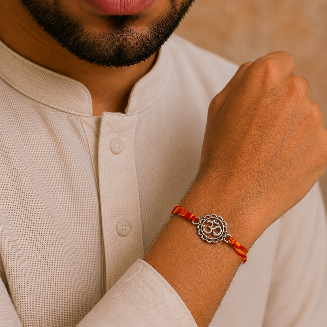 Brother wearing Silver Om Symbol Rakhi by Silviya – 925 silver spiritual rakhi for Raksha Bandhan.
