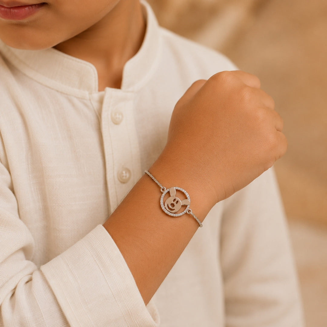 Silver Teddy Rakhi for Kids placed with roli chawal and festive decor – premium 925 silver kids Raksha Bandhan gift by Silviya.