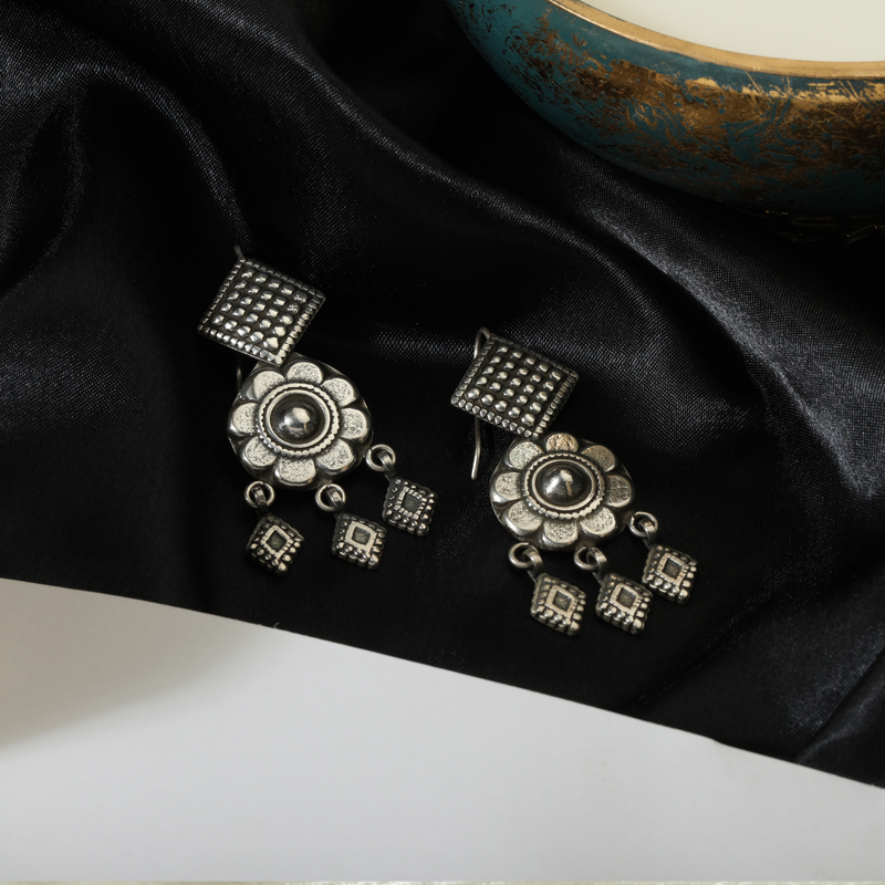 Vintage 925 Oxidized Silver Earrings displayed as prop image on festive background – stylish oxidized silver earrings with fine detailing.