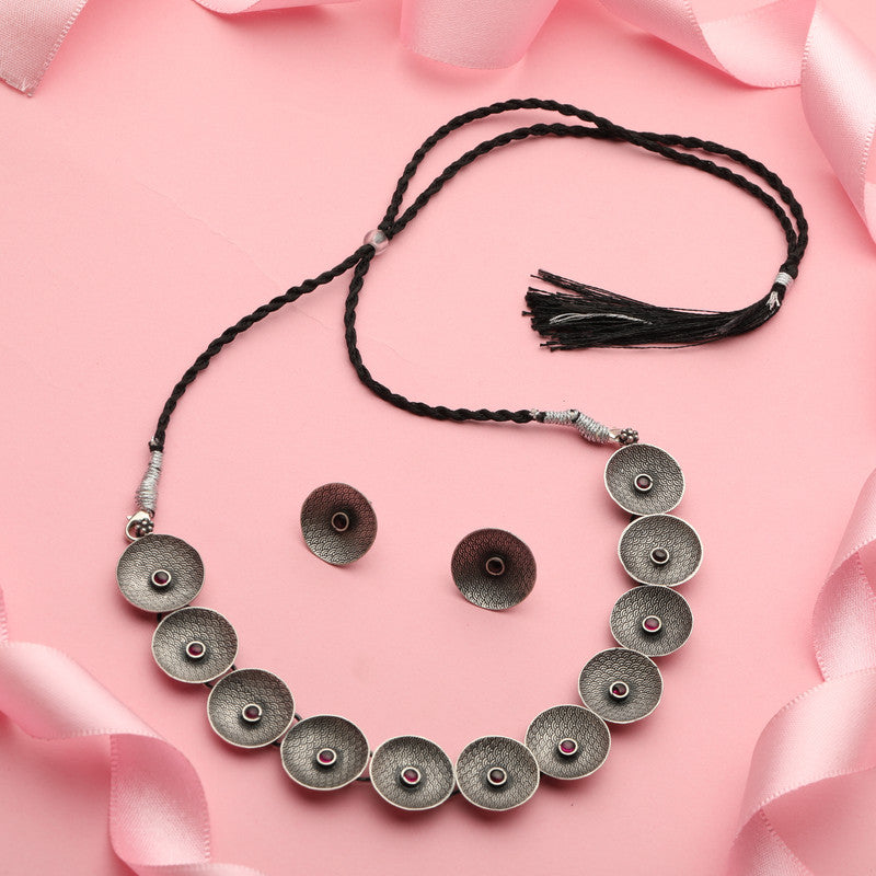 Sterling Silver Warrior Shield Necklace displayed on festive prop for Bhai Dooj gift