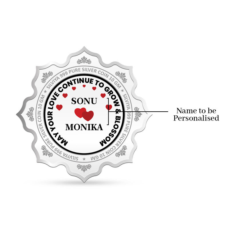 Back side of customized 999 pure silver lotus coin with wedding message and heart icon.