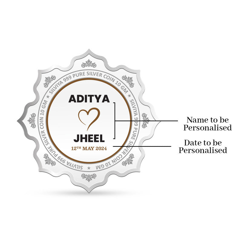 Back view of lotus-shaped 999 pure silver coin with personalized wedding message and heart icon.