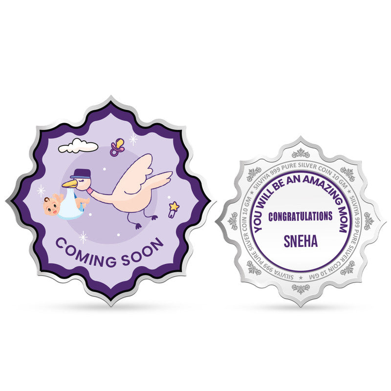 Front and backside of lotus-shaped 999 pure silver customised baby shower coin.