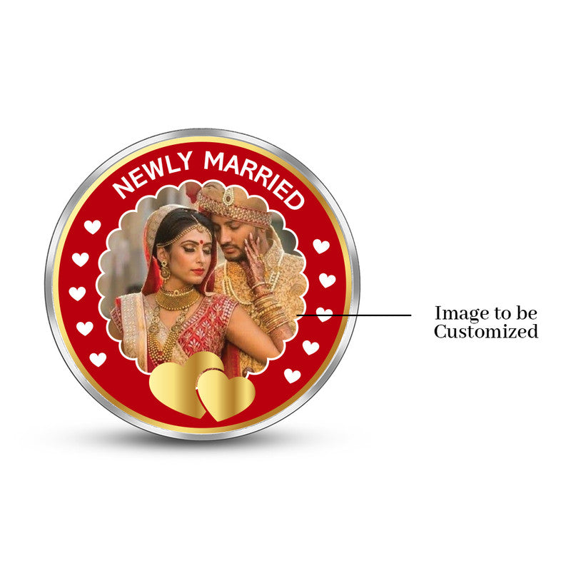 Round pure silver 999 personalized wedding coin featuring couple photo in red decorative frame.