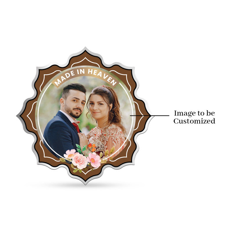 Lotus-shaped 999 pure silver personalized wedding coin featuring couple photo in beige and blue floral frame.