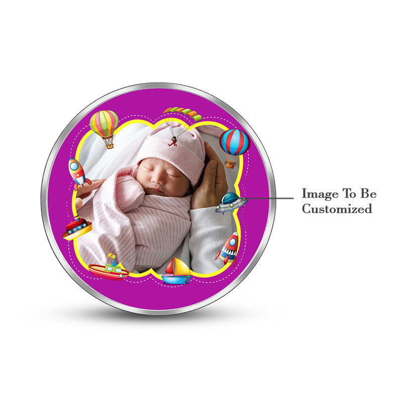 Round 999 silver coin with customised new born baby boy photo.