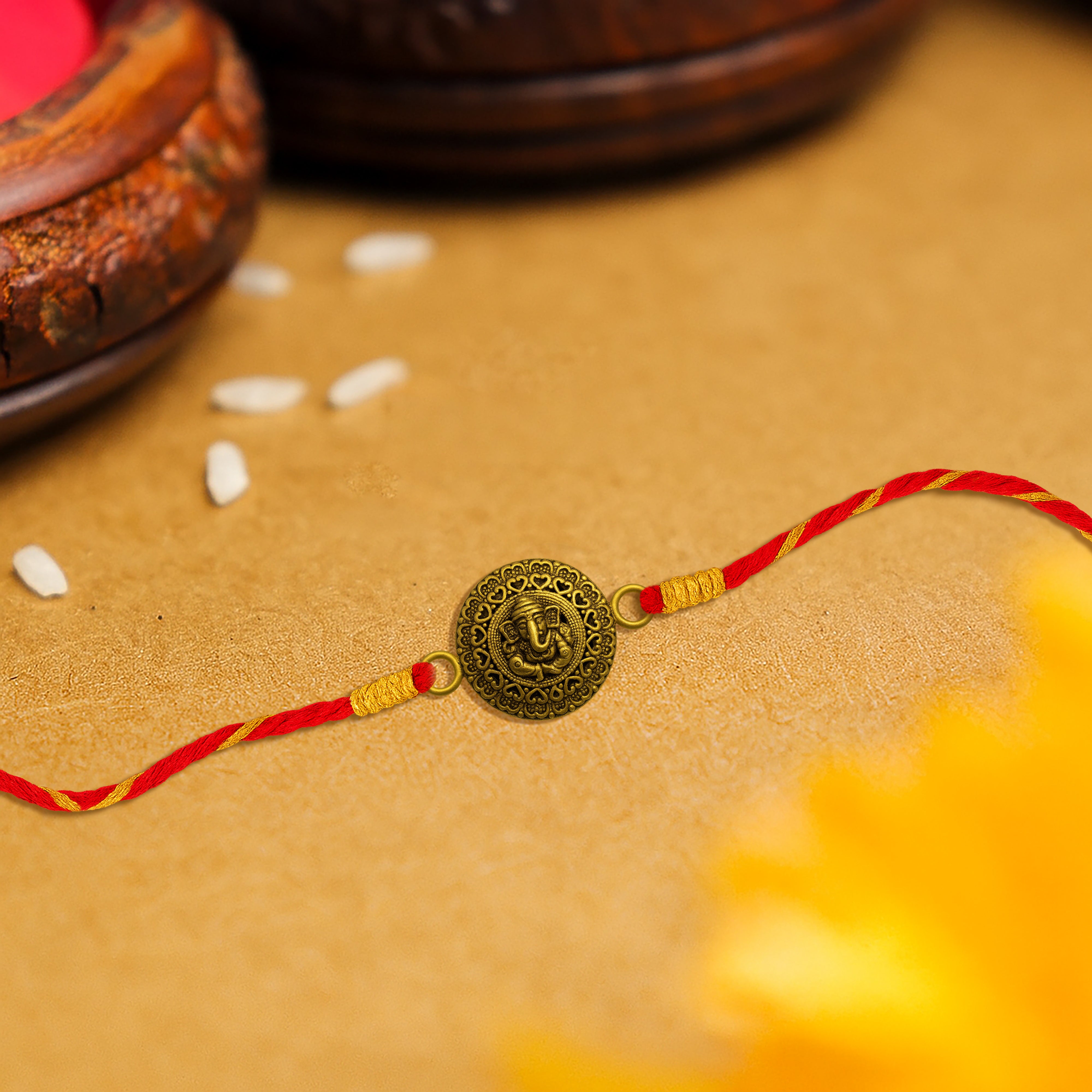 Silver rakhi for brother with embossed Lord Ganesha – original silver rakhi design with price for Raksha Bandhan
