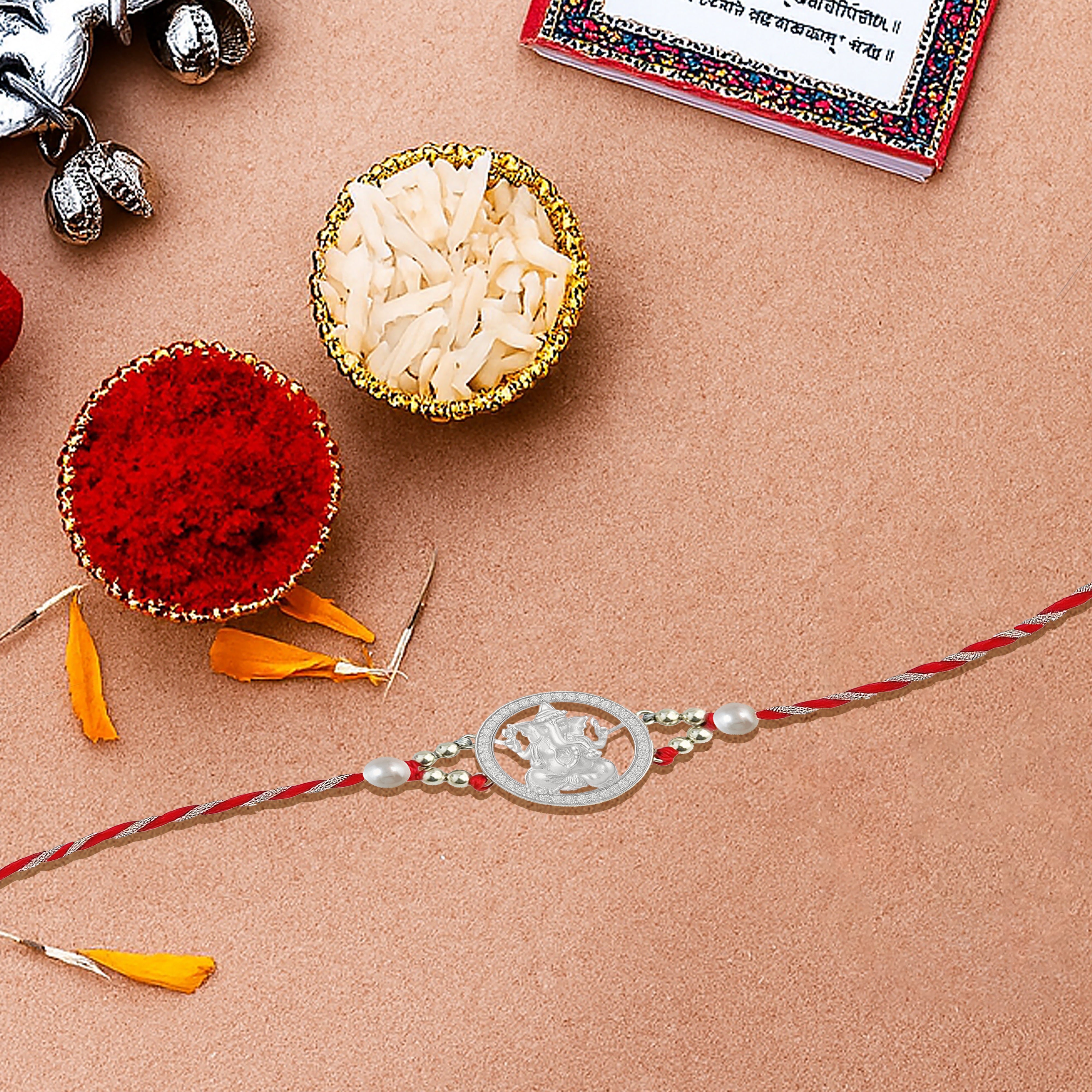 Silver rakhi for brother with Lord Ganpati and stone work – original silver rakhi design with price for Raksha Bandhan