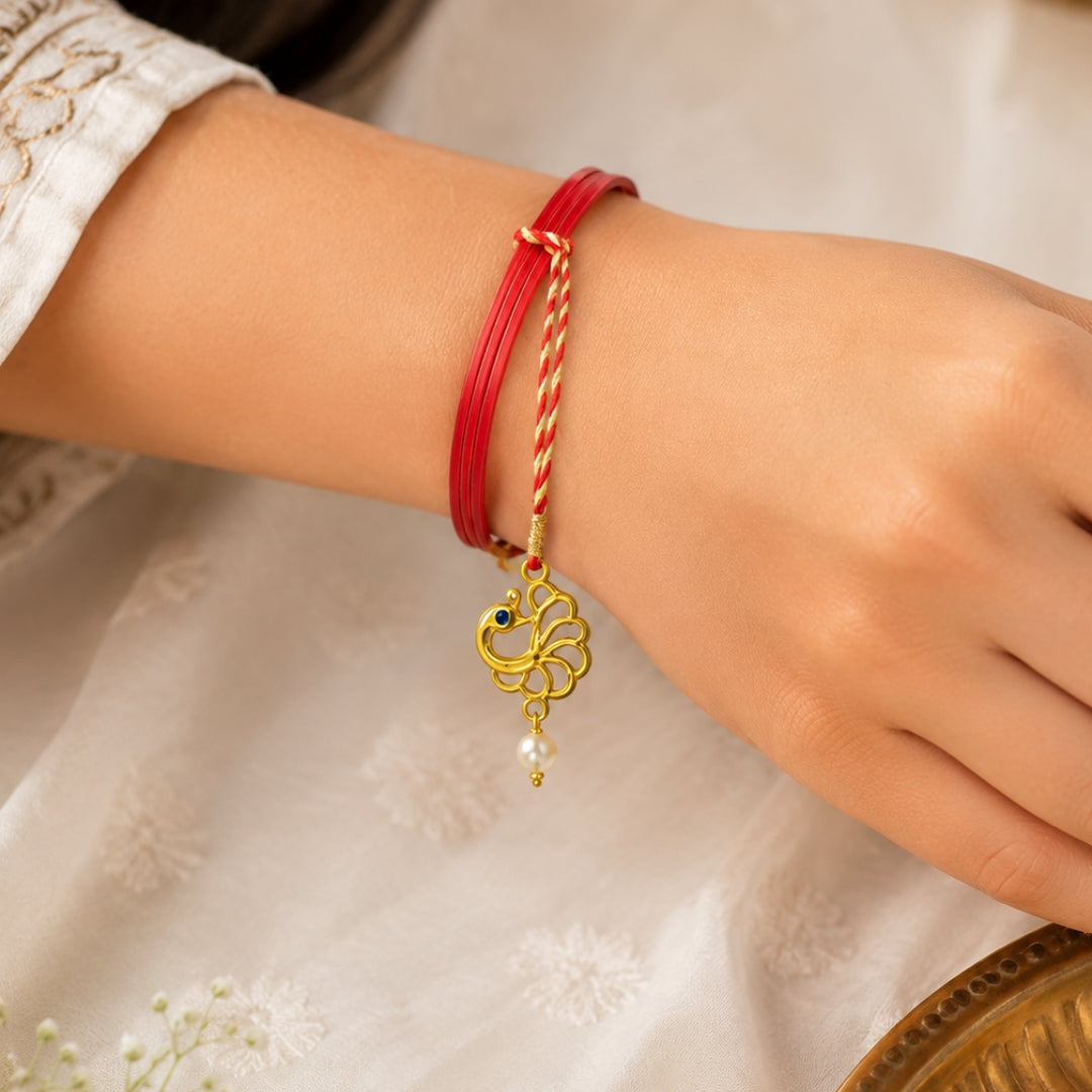 The silver peacock lumba rakhi for Bhabhi by Silviya - an elegant Raksha Bandhan rakhi design.