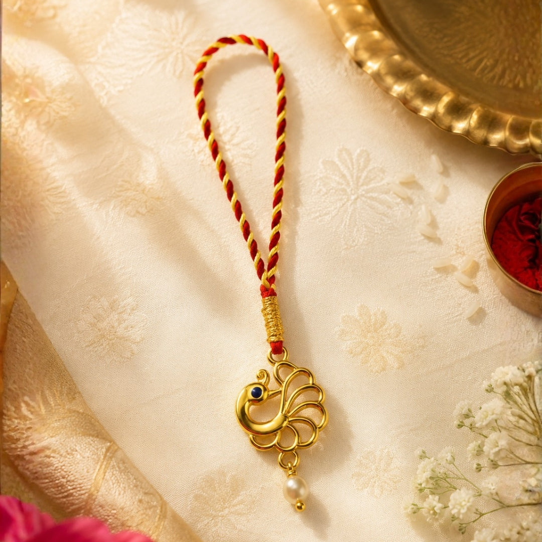 The silver peacock lumba rakhi for Bhabhi by Silviya - an elegant Raksha Bandhan rakhi design.