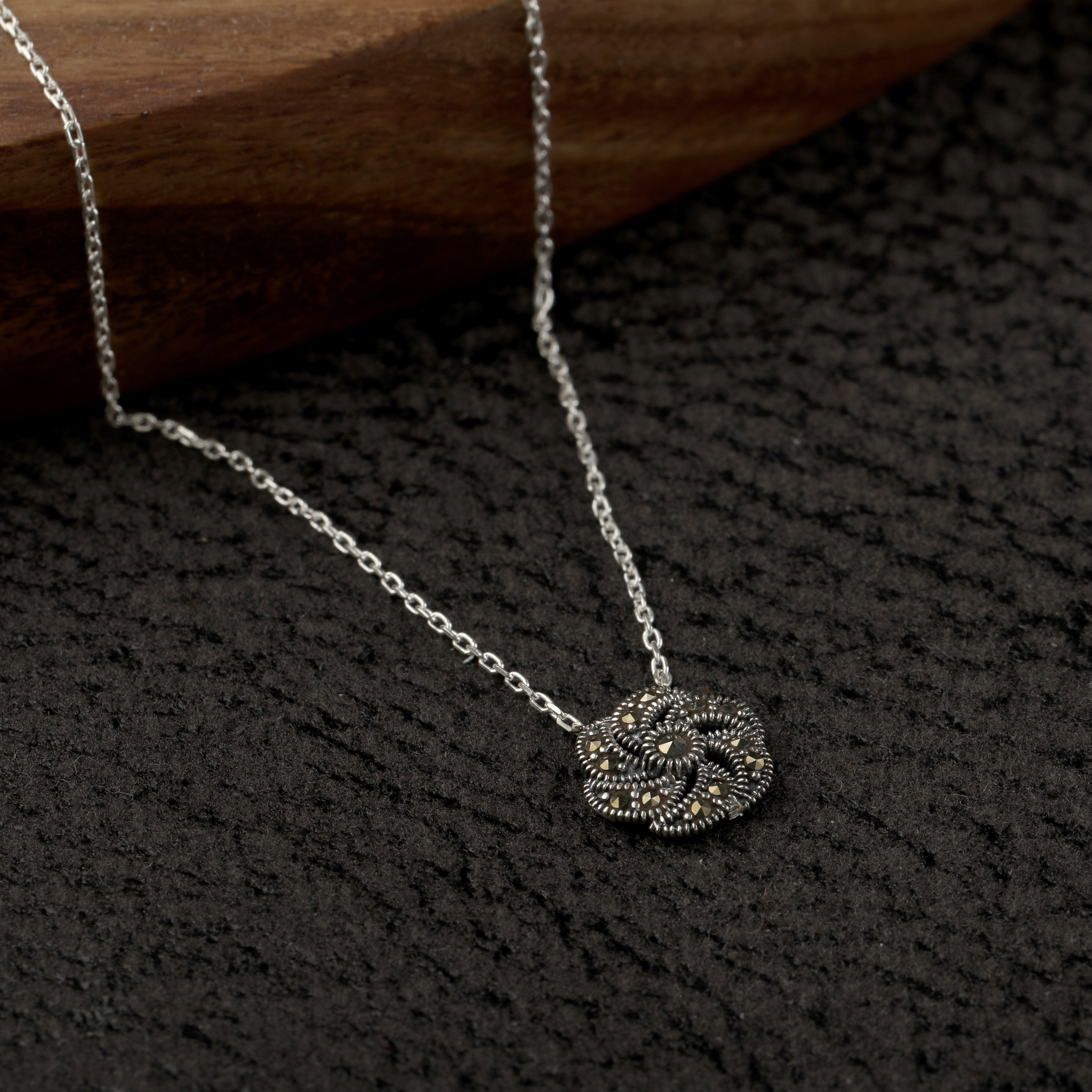 silver spinning charm pendant close up