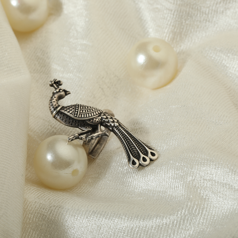 925 Silver Duo Peacock Ring displayed as prop image on festive background – stylish silver ring with fine detailing.