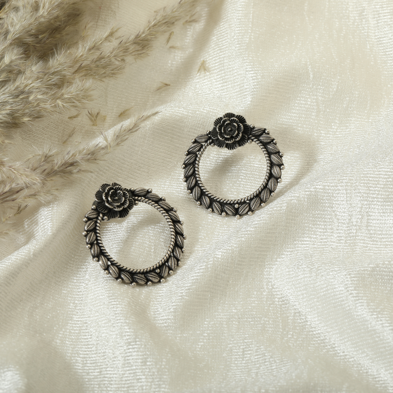925 Silver Floral Leaf Earrings displayed as prop image on festive background – elegant silver earrings with fine detailing.