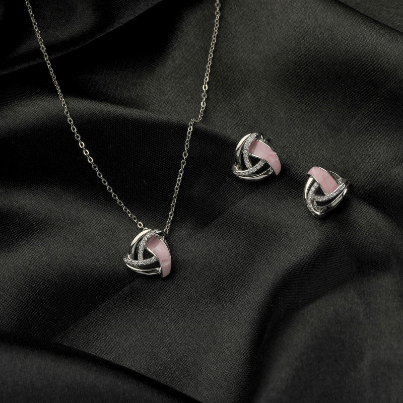 925 silver geometric pendant and earrings displayed with props – modern silver accessory set