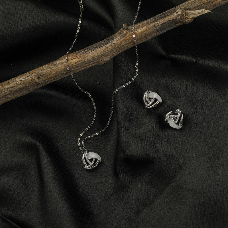925 silver geometric pendant set displayed with props – modern silver accessory