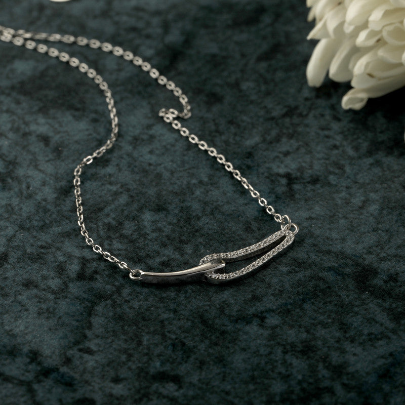 Festive styling with 925 Silver Interlocking Pendant – meaningful silver accessory representing love and togetherness.
