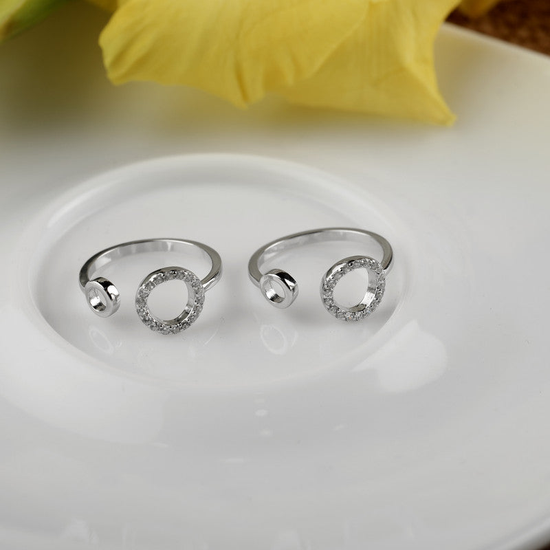 925 silver open circle toe ring displayed with props – minimalist silver accessory