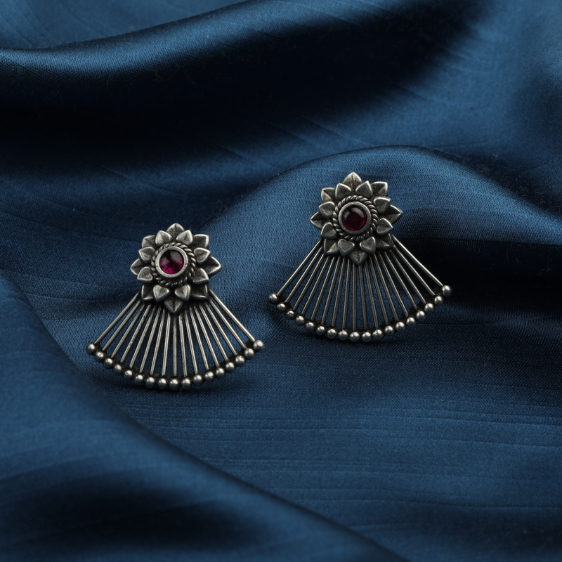 925 Silver Pankhi Earrings displayed as prop image on festive background – stylish silver earrings with fine detailing.