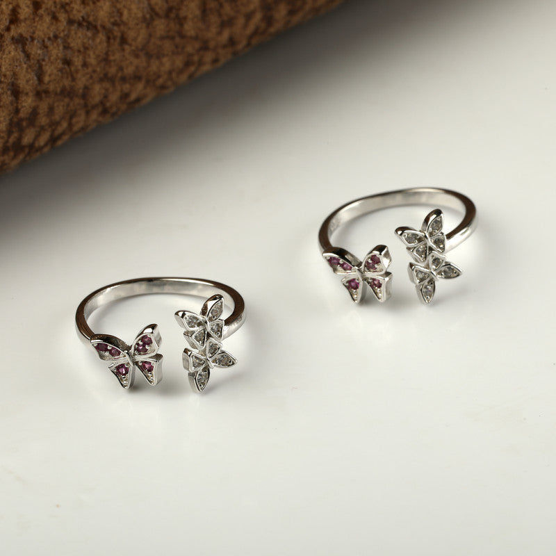 925 silver pink butterfly toe ring displayed with props – unique silver accessory