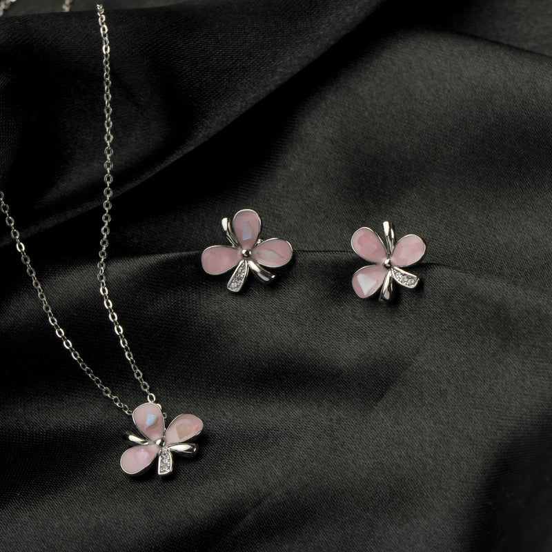 925 silver pink flower pendant and earrings displayed with props – floral silver accessory set