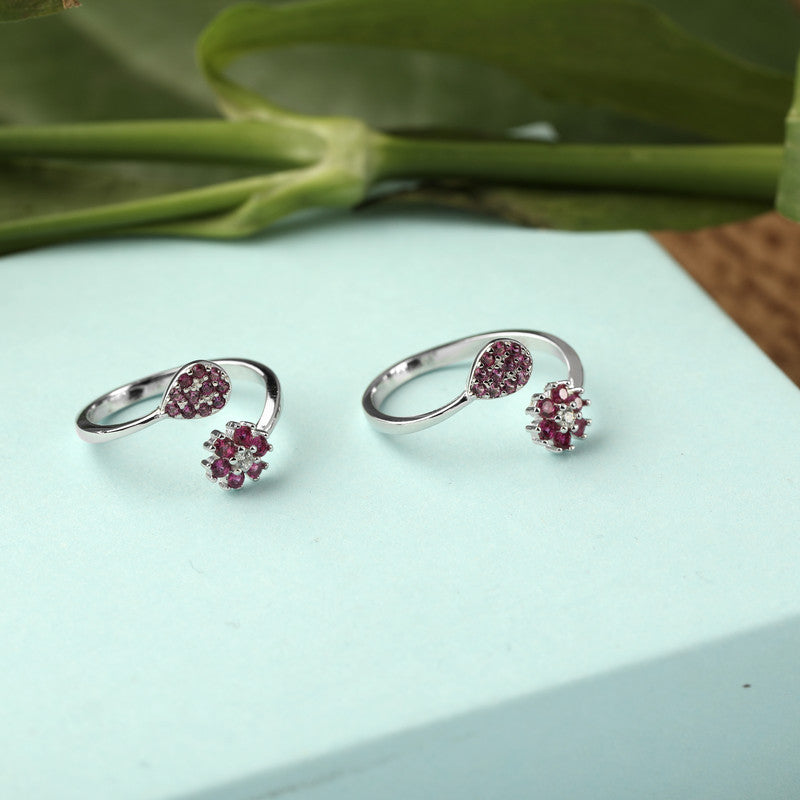 925 silver pink flower and leaf toe ring displayed with props – floral silver accessory