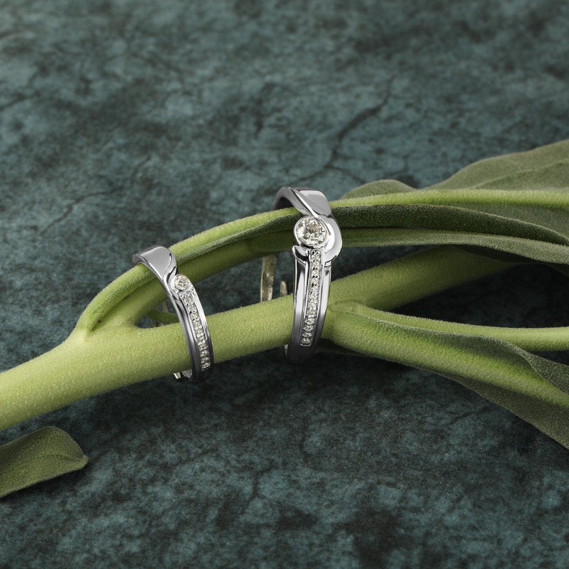 925 silver solitaire couple rings displayed with props – romantic silver accessory set