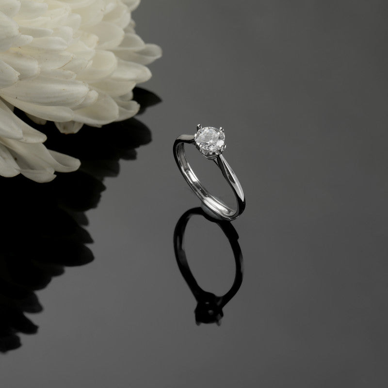 925 silver solitaire ring displayed with props – classic silver accessory