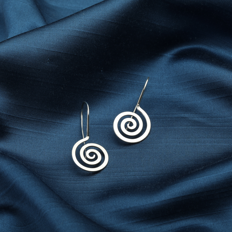 925 Silver Spiral Earrings displayed as prop image on festive background – stylish silver earrings with fine detailing.