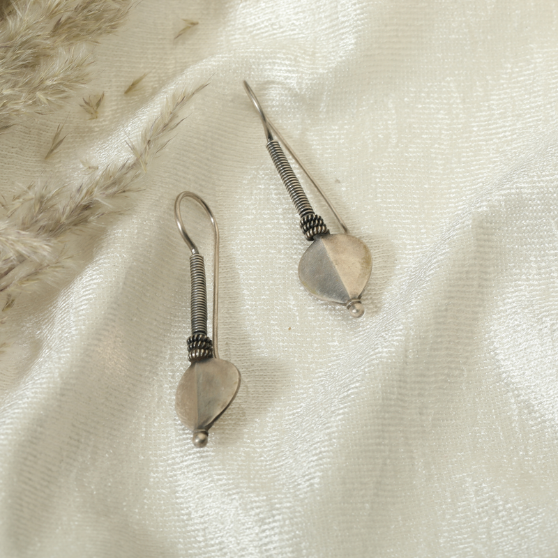 925 Silver Spiral Heart Earrings prop display showing design details