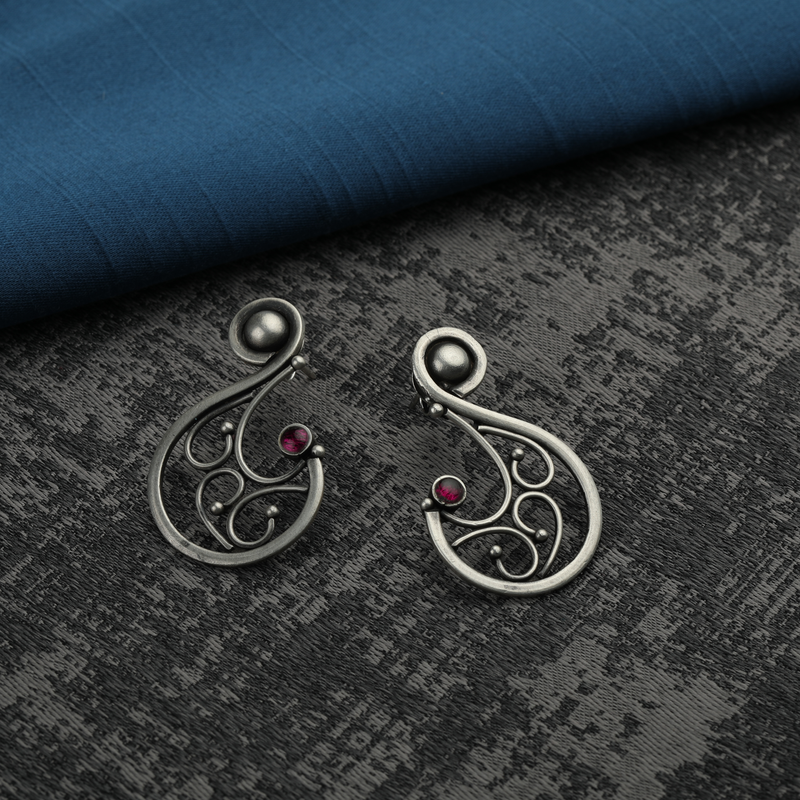 925 Silver Swirl Earrings displayed as prop image on festive background – trendy silver earrings with fine detailing.