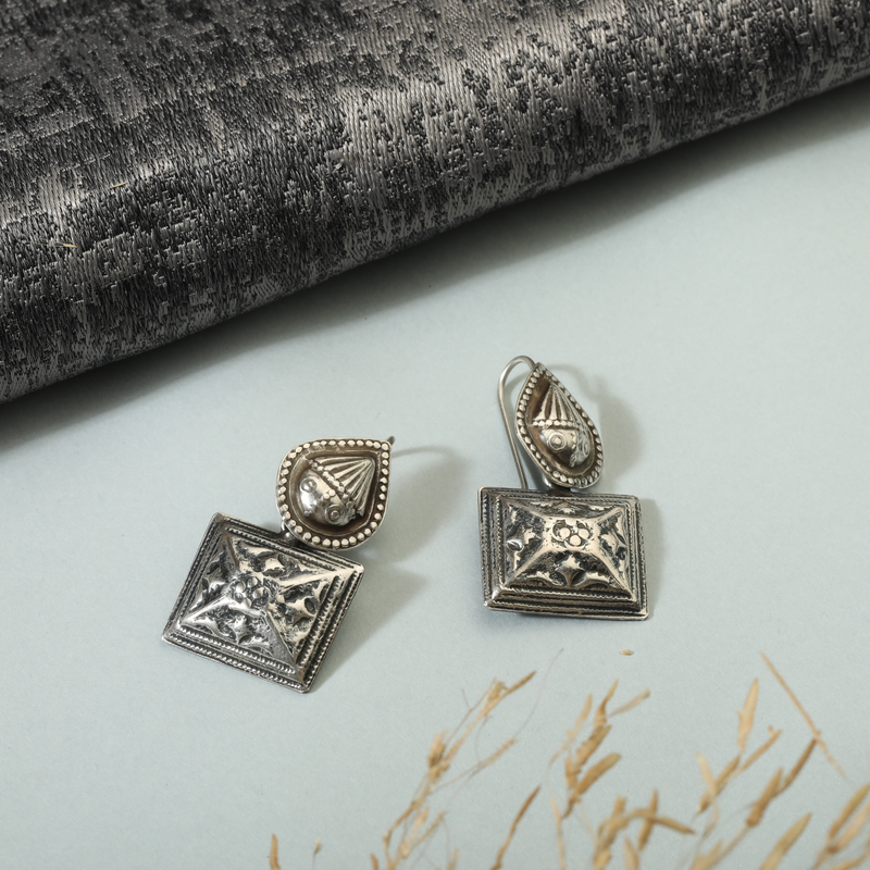 925 Silver Teardrop & Square Earrings displayed as prop image on festive background – trendy silver earrings with fine detailing.