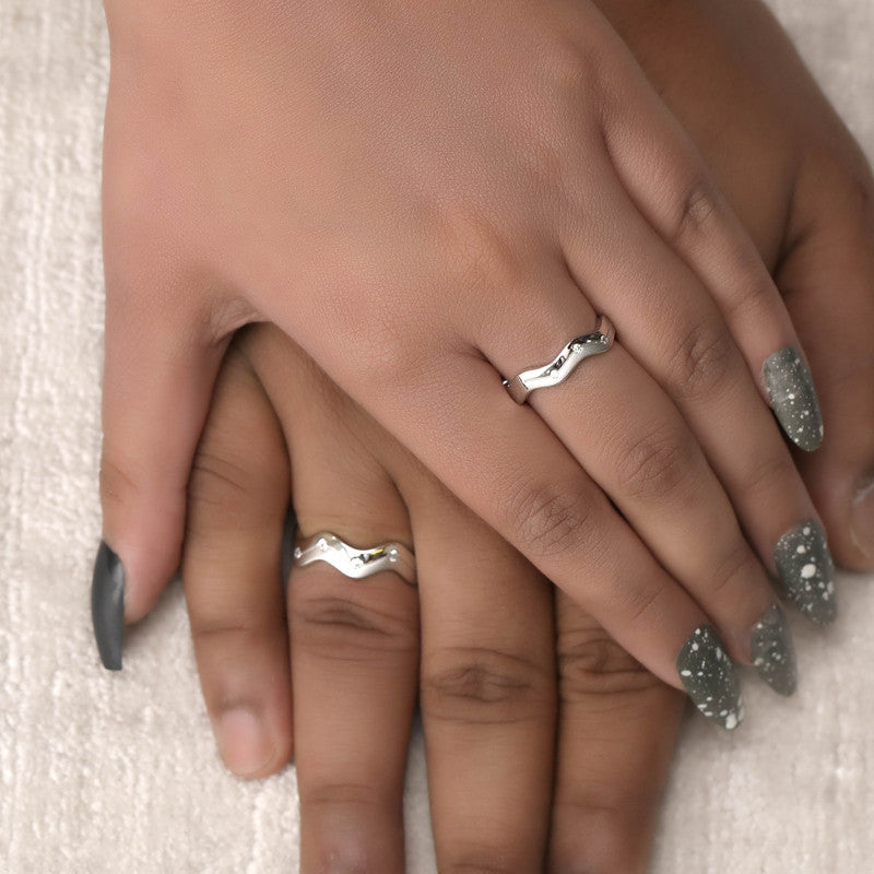 Man and woman wearing 925 silver wavy couple bands – stylish matching jewelry set
