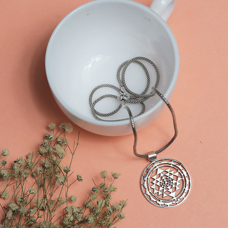 Men’s 925 Sterling Silver Chakra Pendant with Detailed Spiritual Symbol displayed on surface