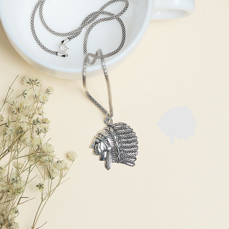 Men’s 925 Sterling Silver Chief Pendant with Detailed Warrior Head Design displayed on surface