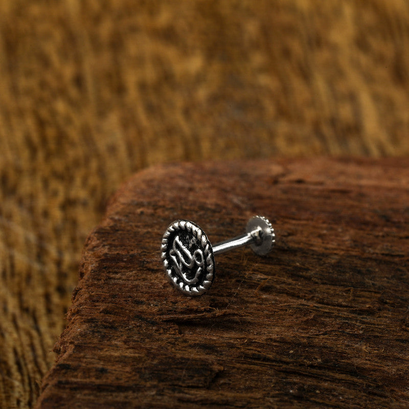 925 sterling silver filigree nose pin on wooden surface – traditional silver nose accessory