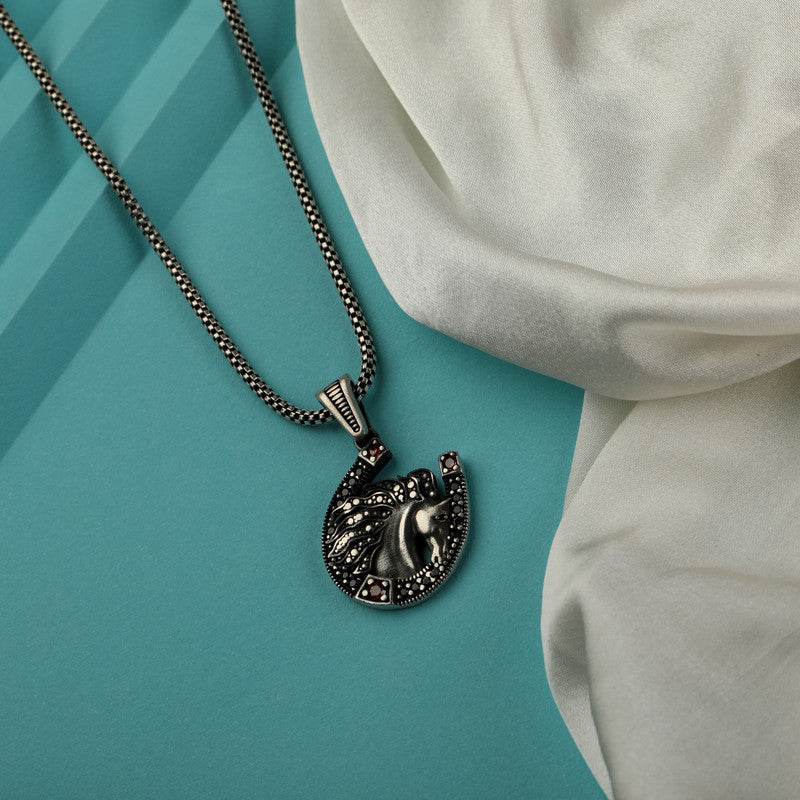 Men’s 925 Sterling Silver Horse Pendant with Detailed Horse Design displayed on surface