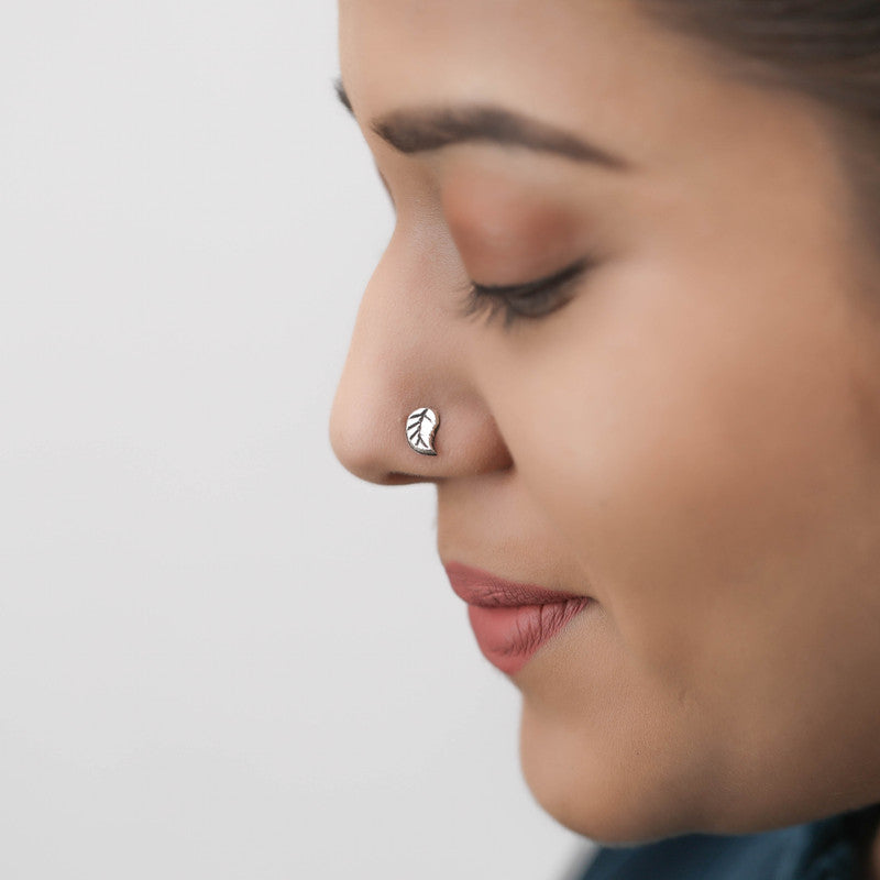 Woman wearing 925 Sterling Silver Leaf Nose Pin styled on nose
