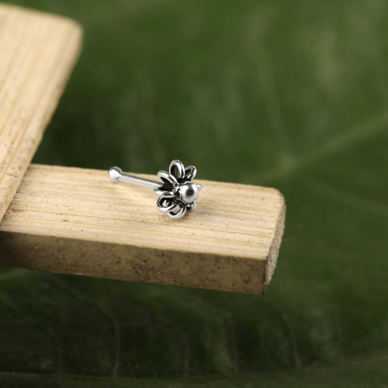 Close-up of 925 Sterling Silver Mohak Nose Pin placed on wooden surface